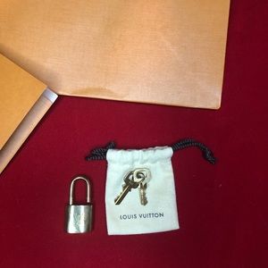 Louis Vuitton lock key new with receipt